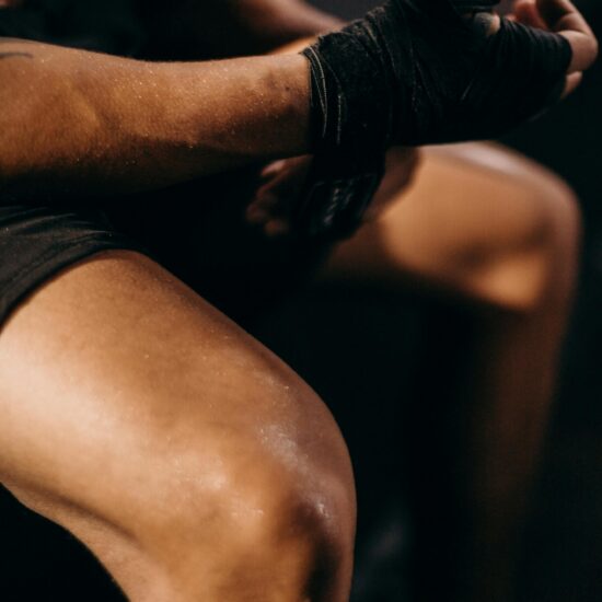 a boxer sitting wrapping wrists